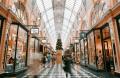 Busy shopping arcade decorated for the holidays, representing seasonal triggers and social pressures in recovery