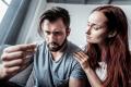 concerned couple looking at pill linked to MGM15 and kratom-based drug risks
