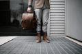 Person standing with a backpack, symbolizing preparation for addiction treatment and recovery