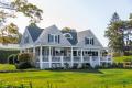 Large residential home with landscaped grounds representing a supportive and comfortable recovery environment