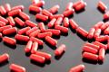 Red capsules representing ZaZa and tianeptine products known as gas station heroin