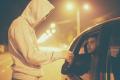 Illustration of an illegal street drug transaction occurring at night between a pedestrian and a person in a vehicle