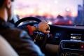 Person driving a car at dusk, representing responsible decision-making, recovery, and everyday life after treatment