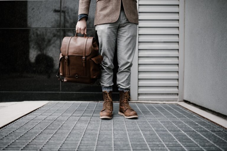 Person standing with a backpack, symbolizing preparation for addiction treatment and recovery