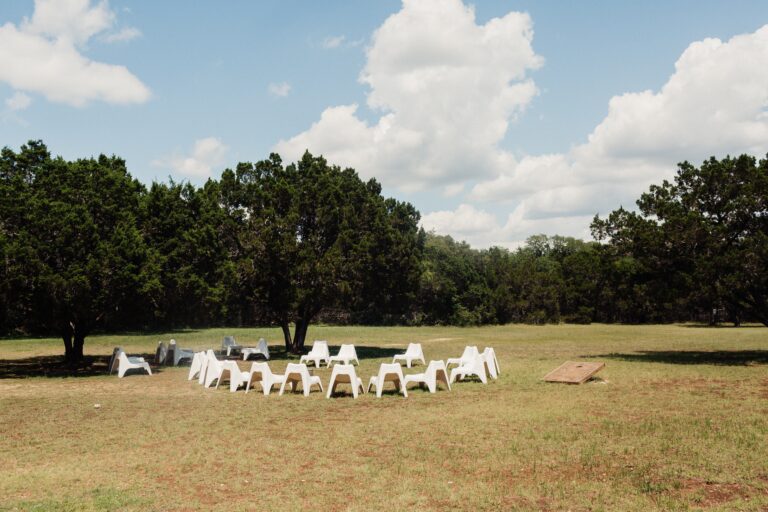 Outdoor recovery group seating area arranged in a circle on a grassy field
