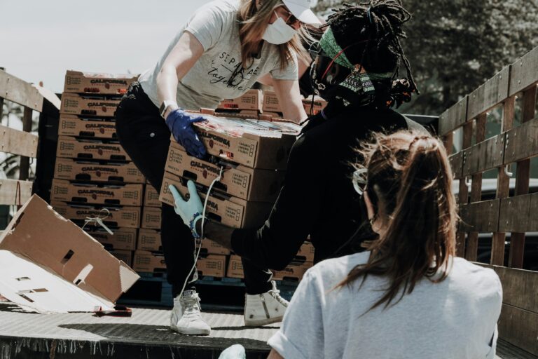 Volunteers unloading food boxes and supplies during a community outreach effort